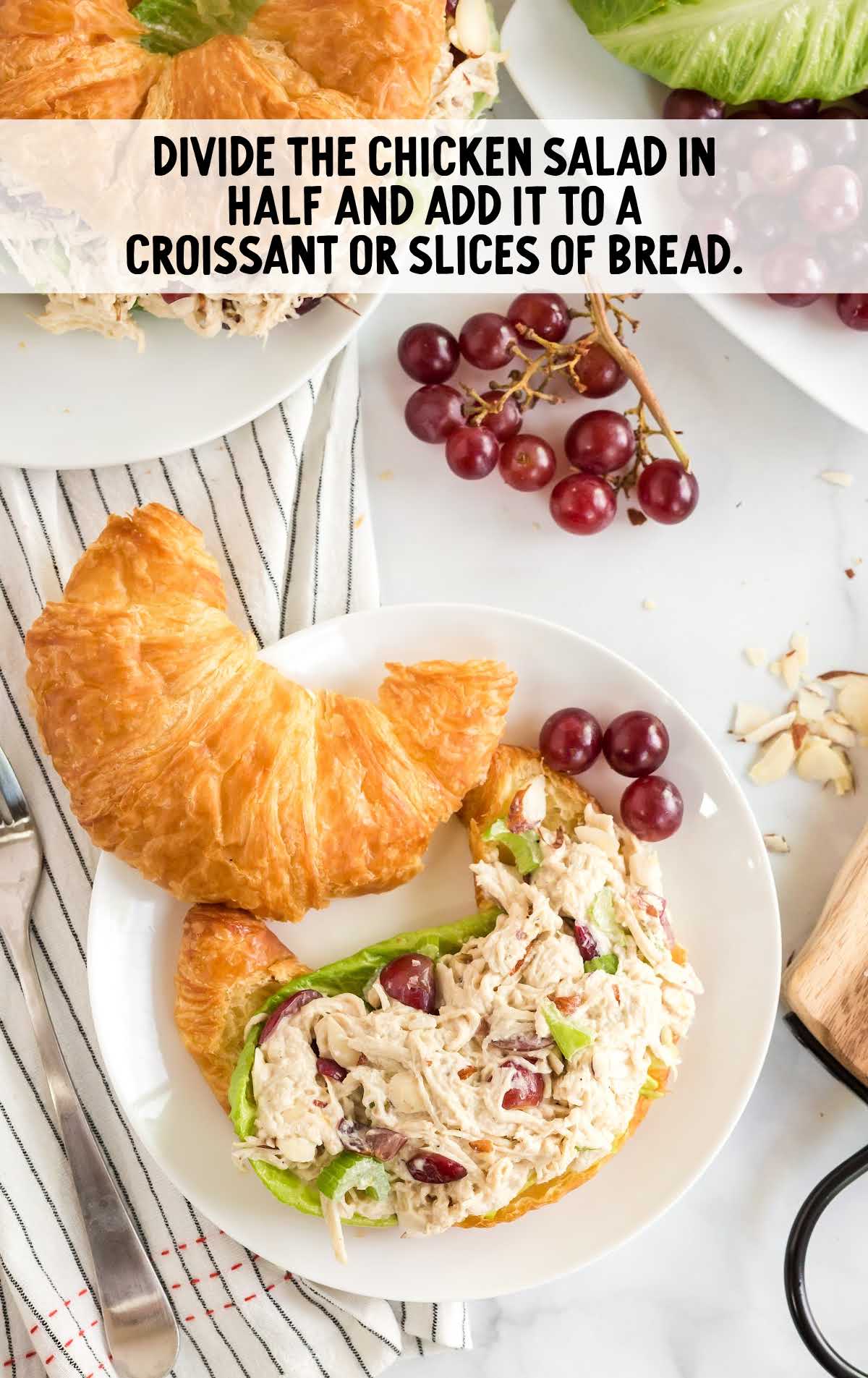 chicken salad mixture placed in a croissant on a plate