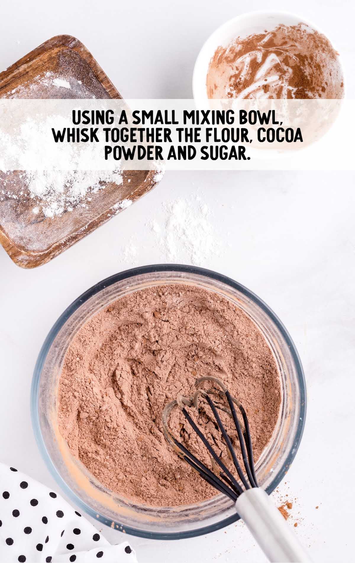 flour, cocoa powder, and sugar whisked together in a bowl