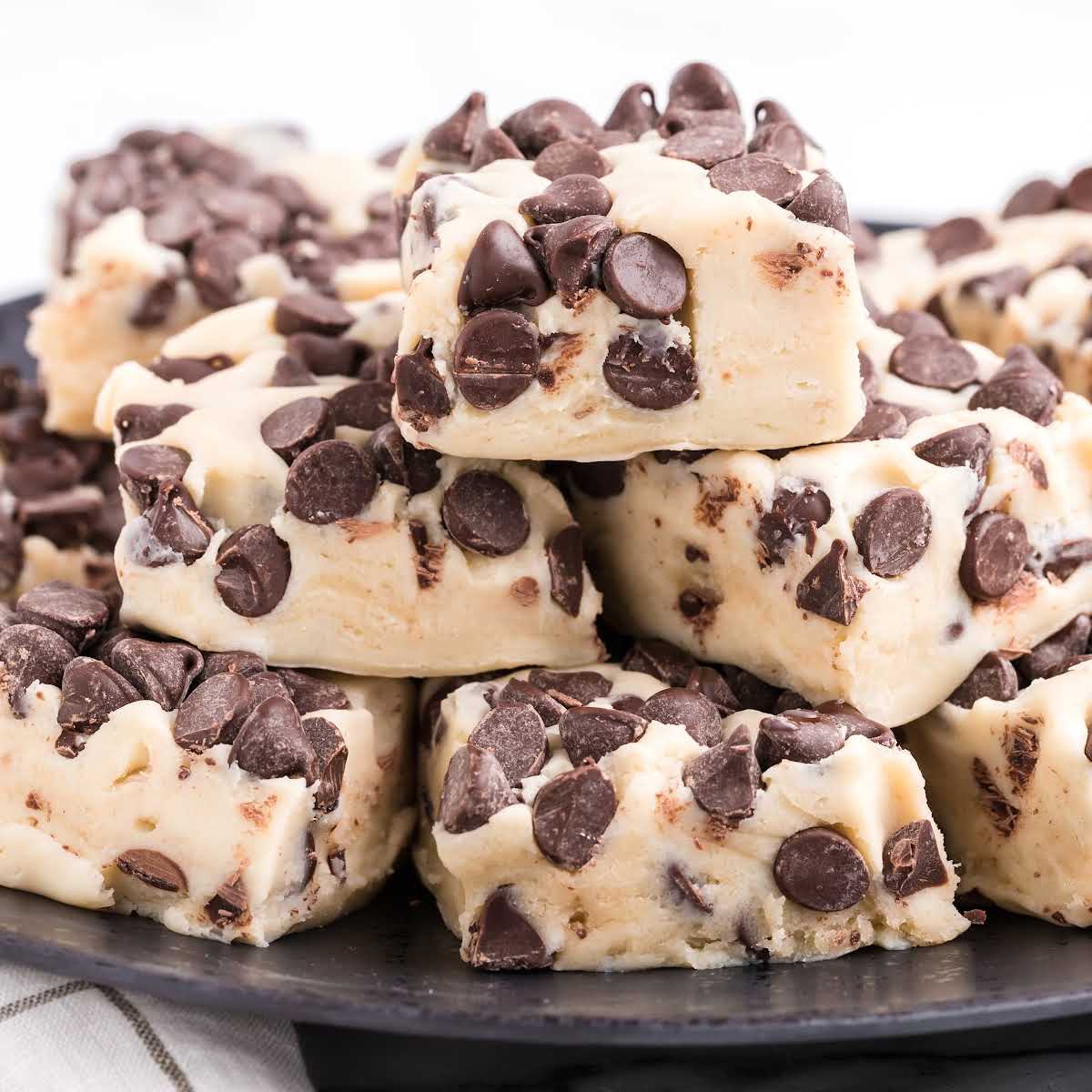 close up shot of bars of cookie dough placed on a serving tray