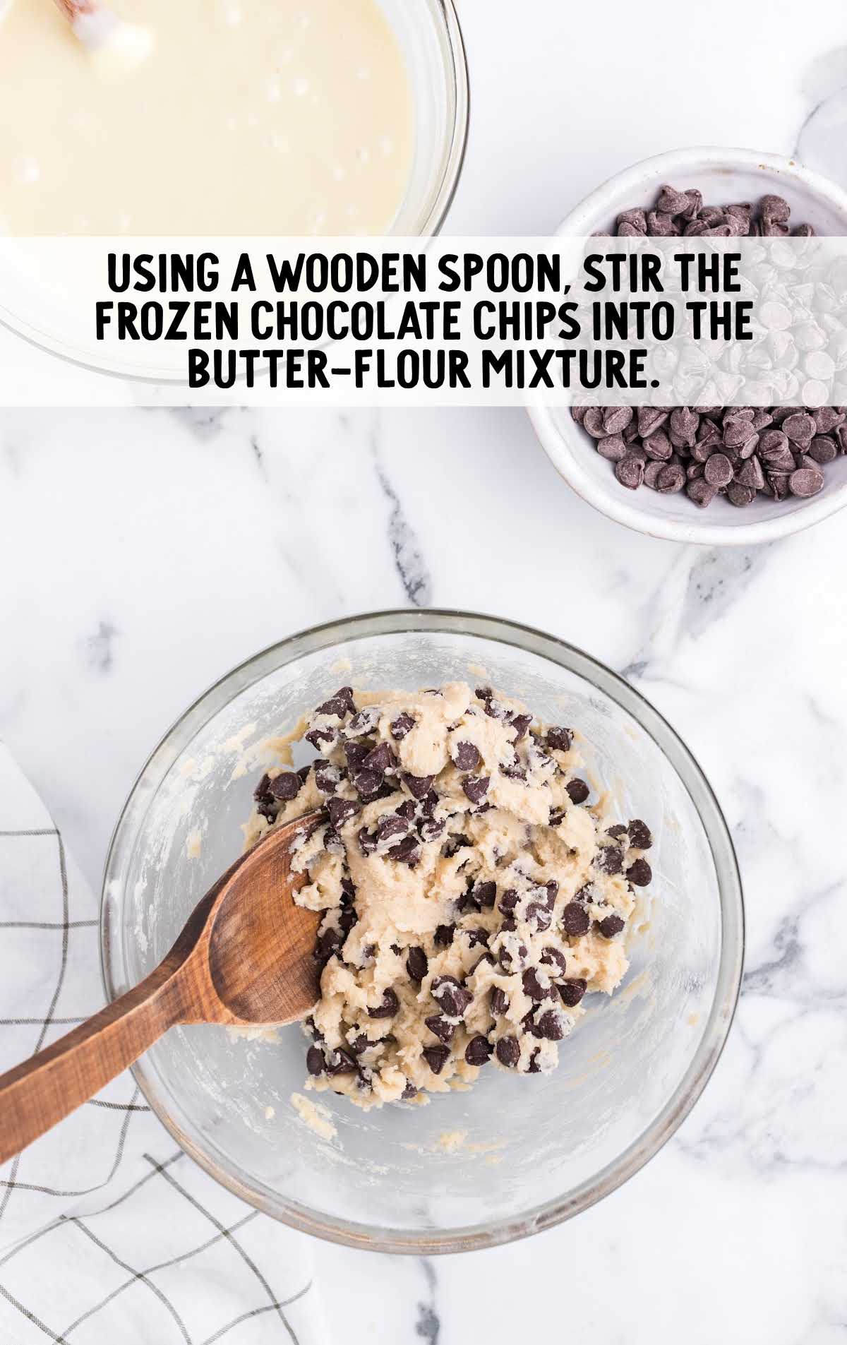 chocolate chips folded into the butter mixture in a bowl