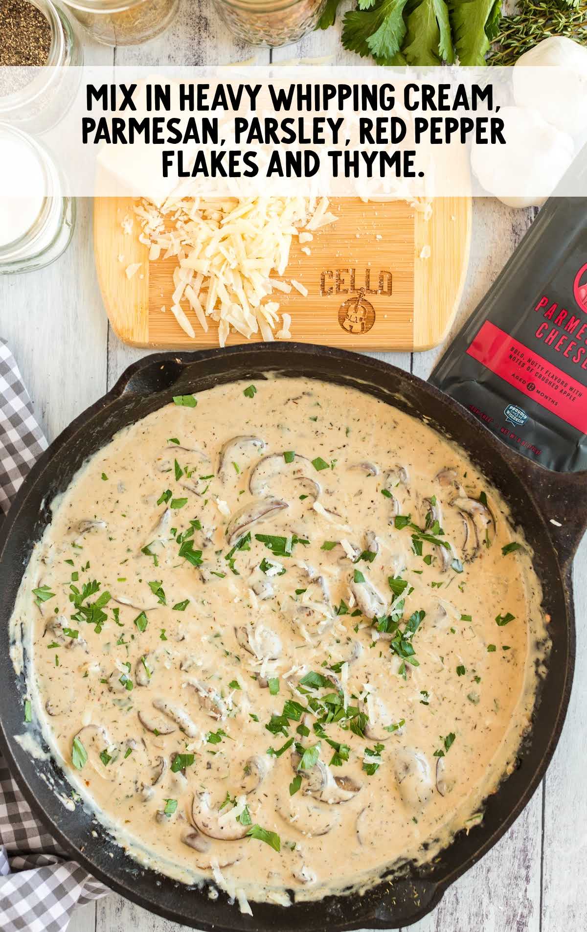 heavy cream, parmesan, and seasonings added to the skillet