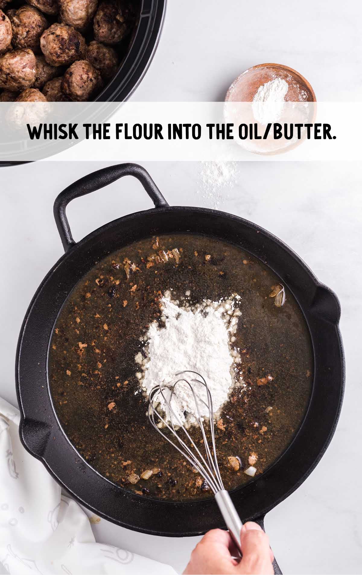 flour whisked on the skillet of oil and butter