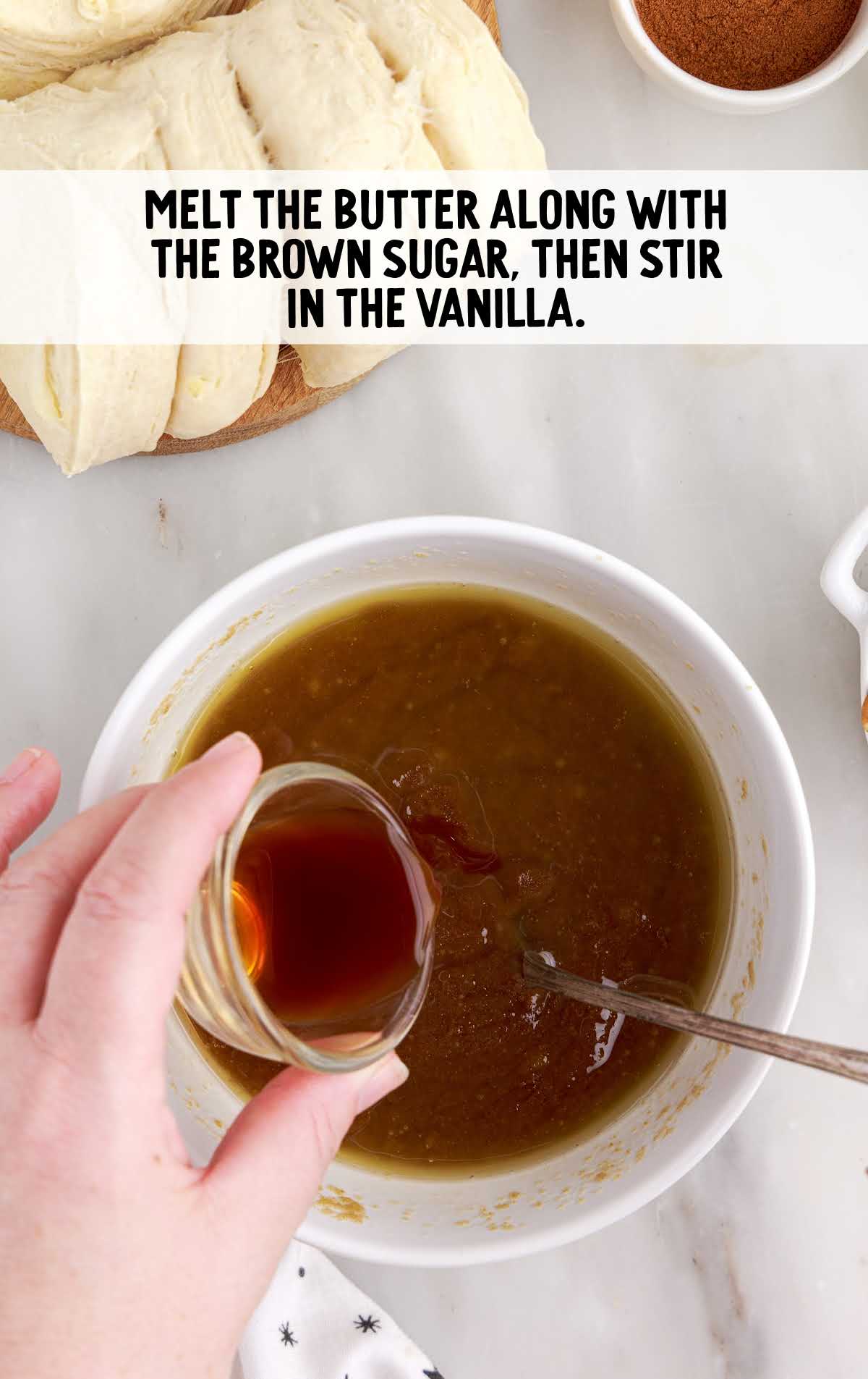 melted butter, brown sugar, and vanilla being combined in a bowl