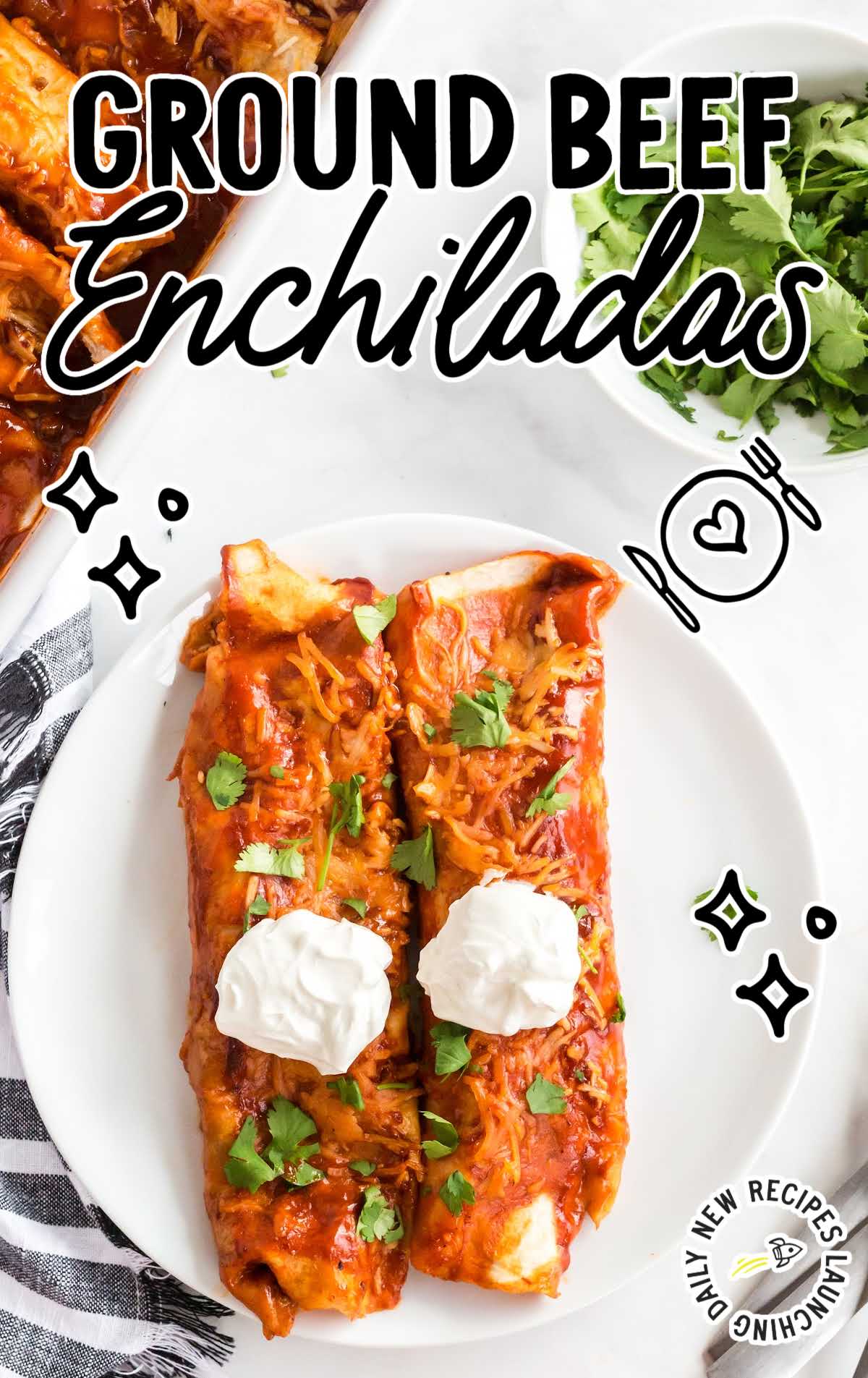 overhead shot of a plate of Ground Beef Enchiladas topped with cilantro and sour cream