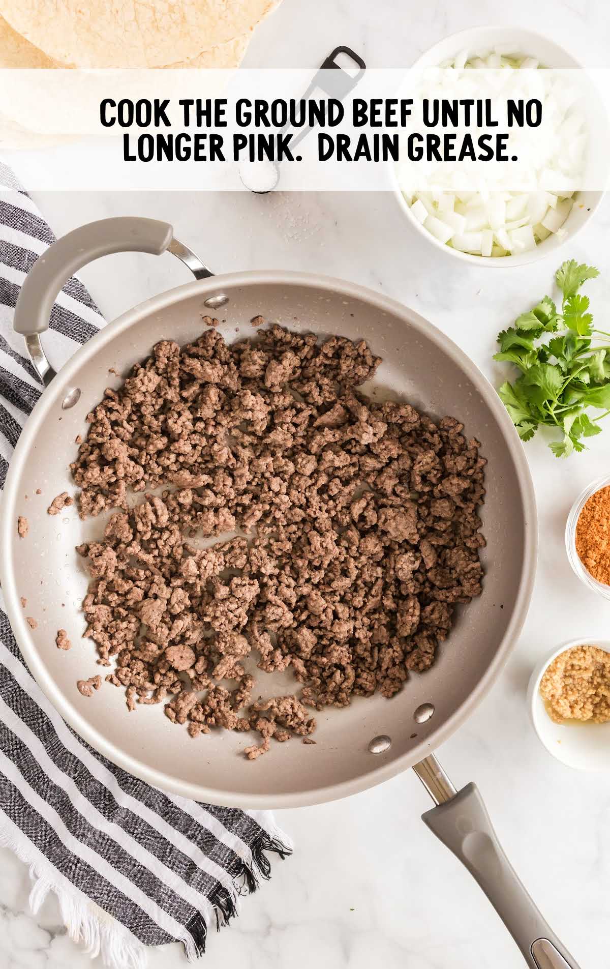 ground beef cooked and drained in a skillet