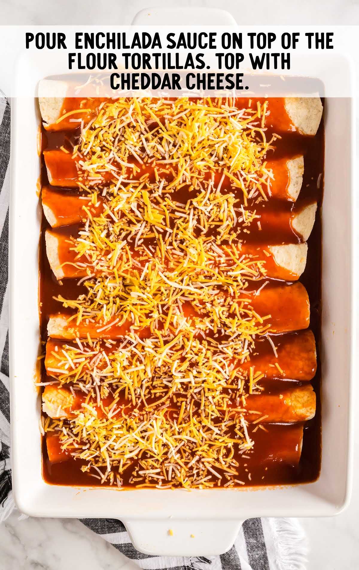 tortillas topped with enchilada sauce and cheese in a baking dish