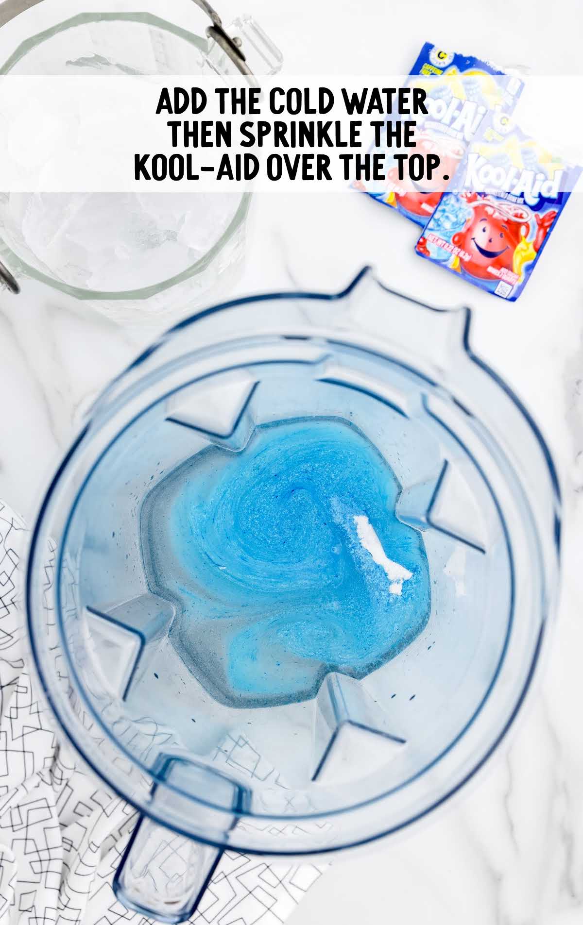 cold water and kool-aid packets added to the blender