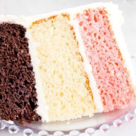 close up shot of a slice of Neapolitan Cake on a plate