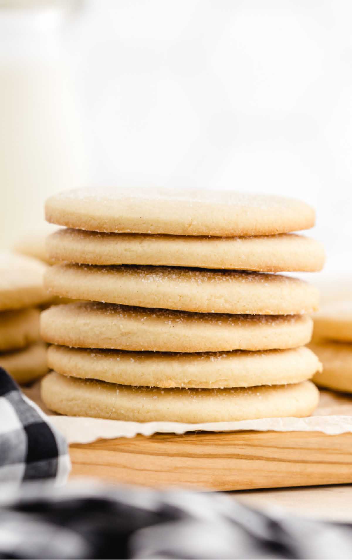 close up shot of sugar cookies stacked on top of each other