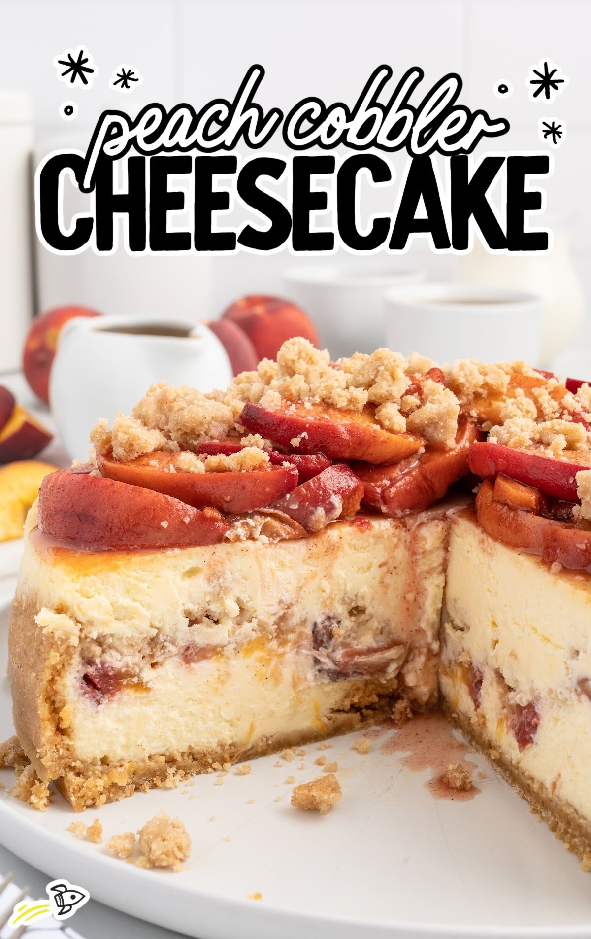 A sliced open Peach Cobbler Cheesecake on a serving platter.