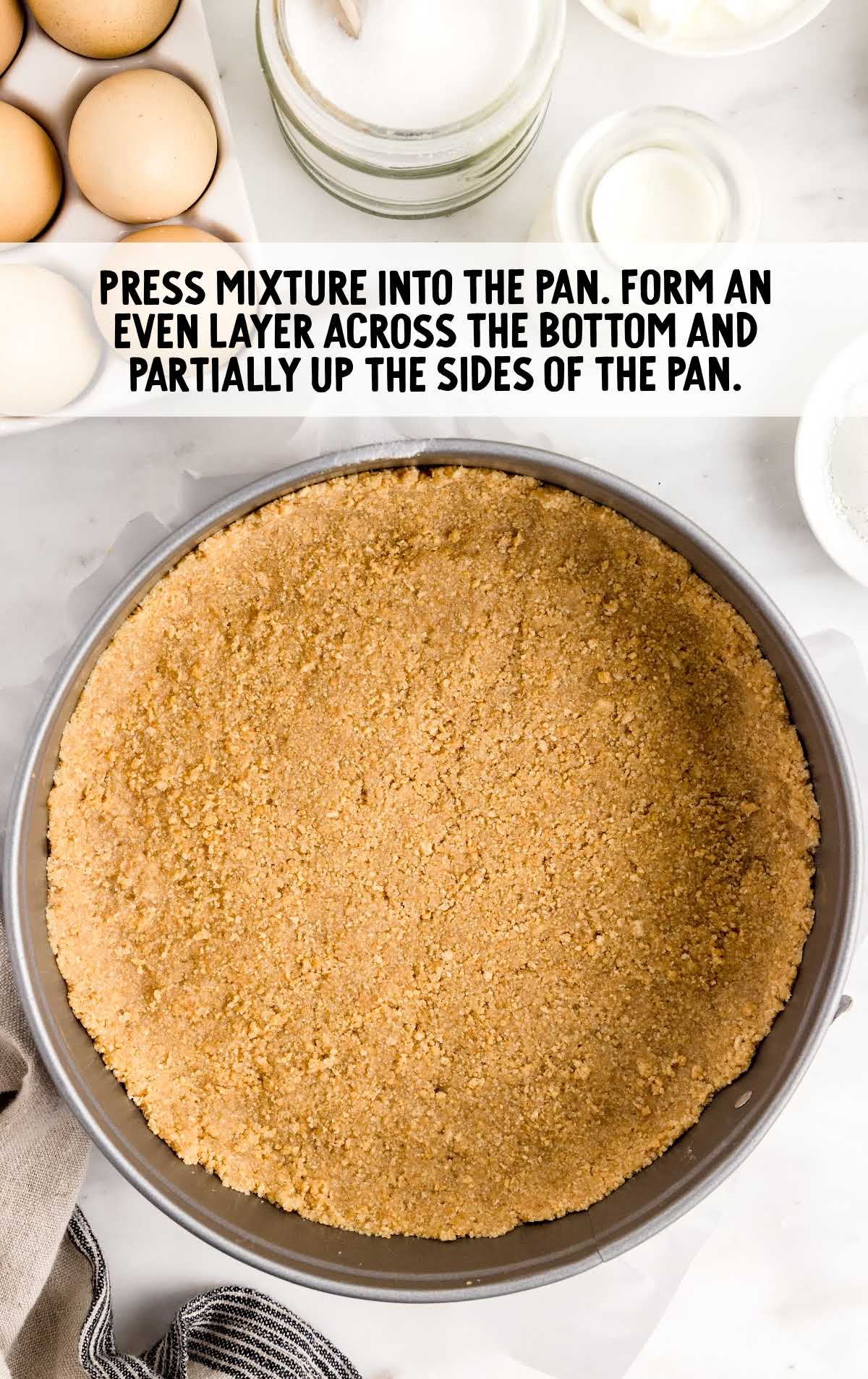 graham cracker mixture pressed into the bottom of a pan