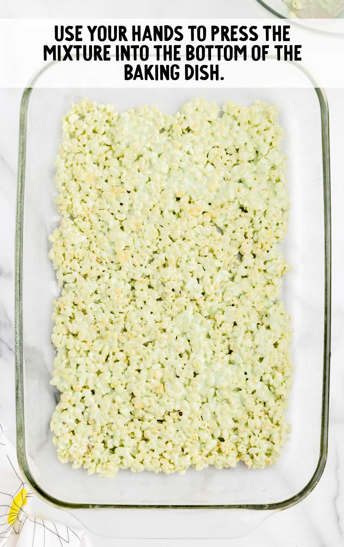 Rice Krispie mixture pressed into the bottom of a pan
