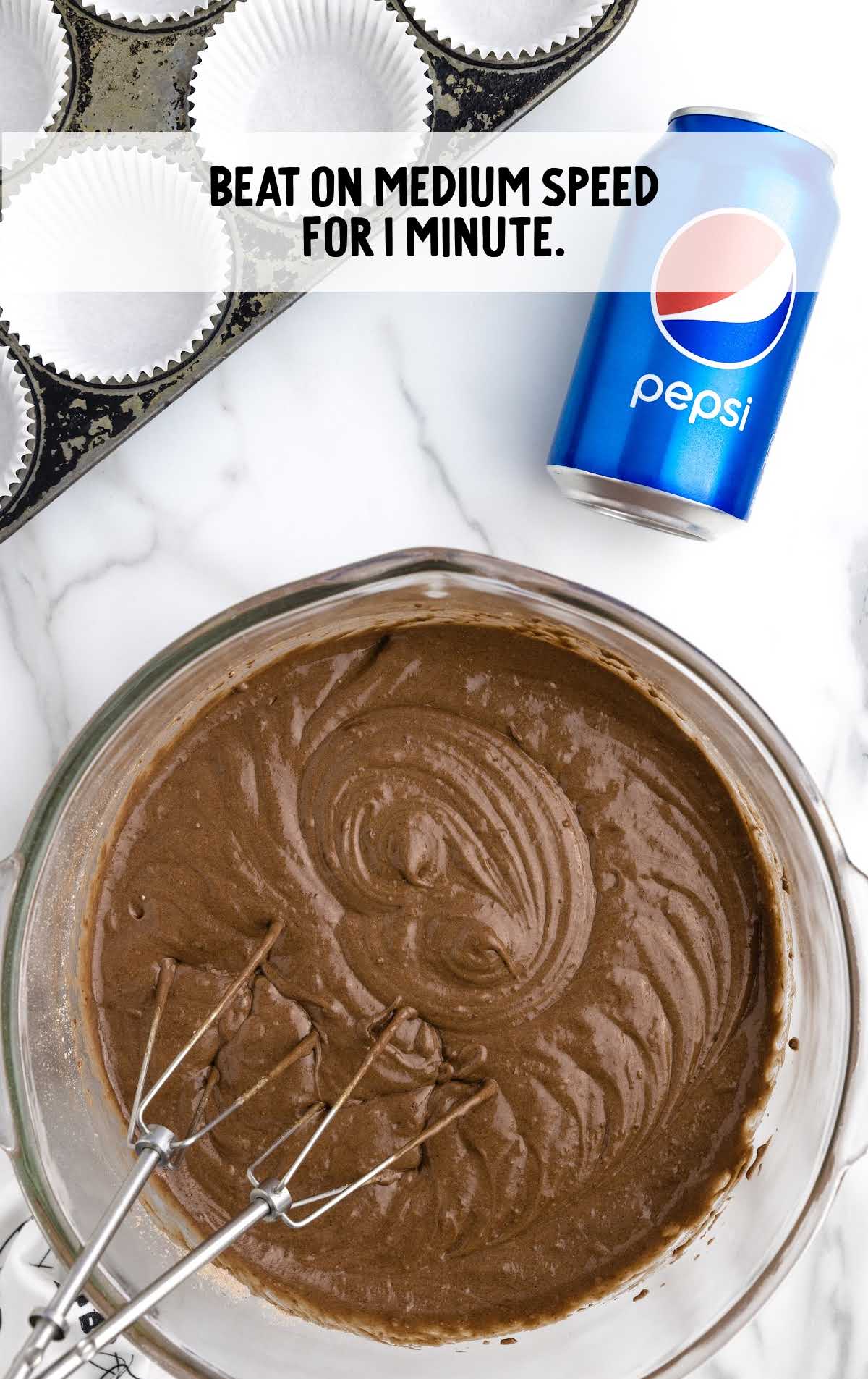 cake mix and Pepsi blended together in a bowl