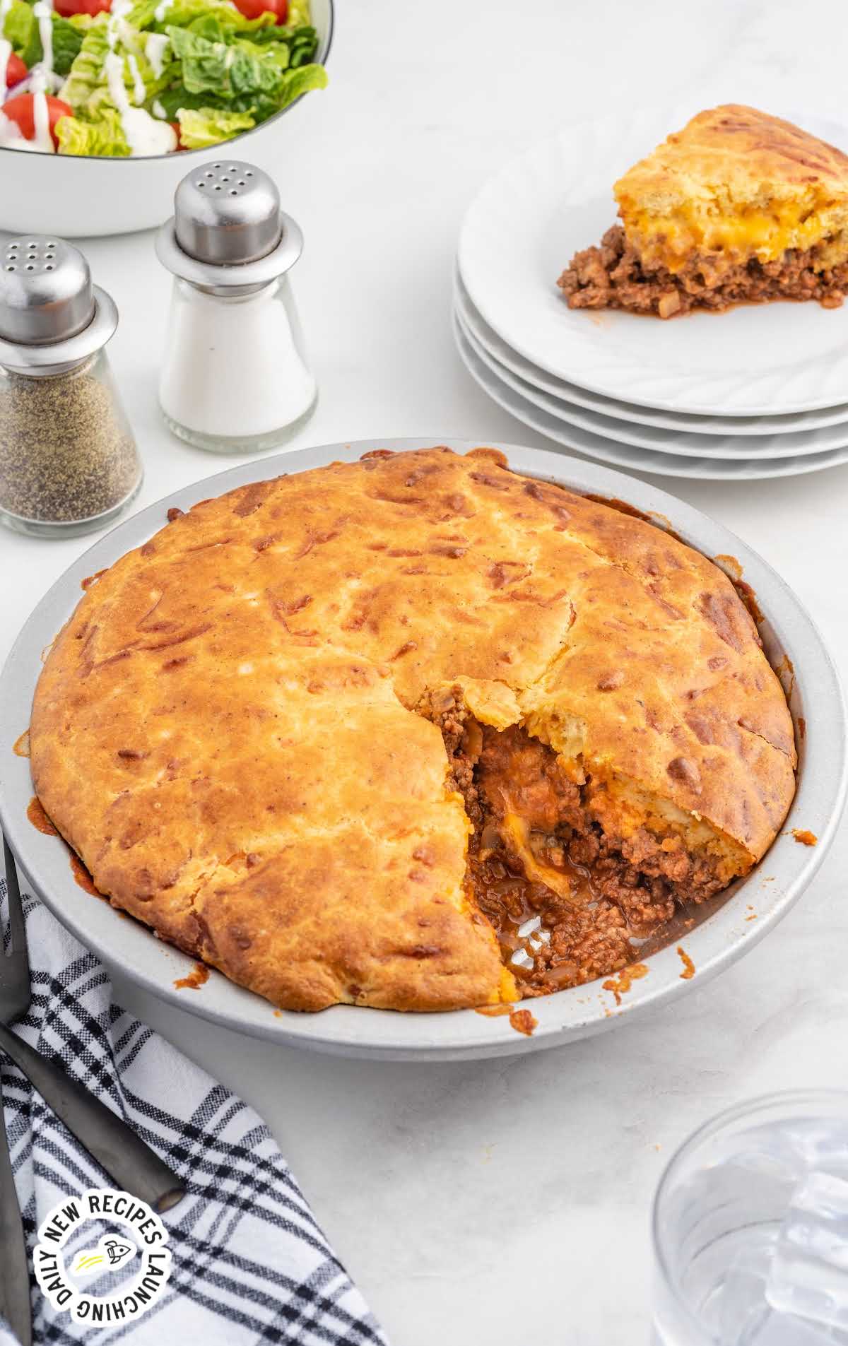 close up shot of a Sloppy Joe Pie with a slice missing