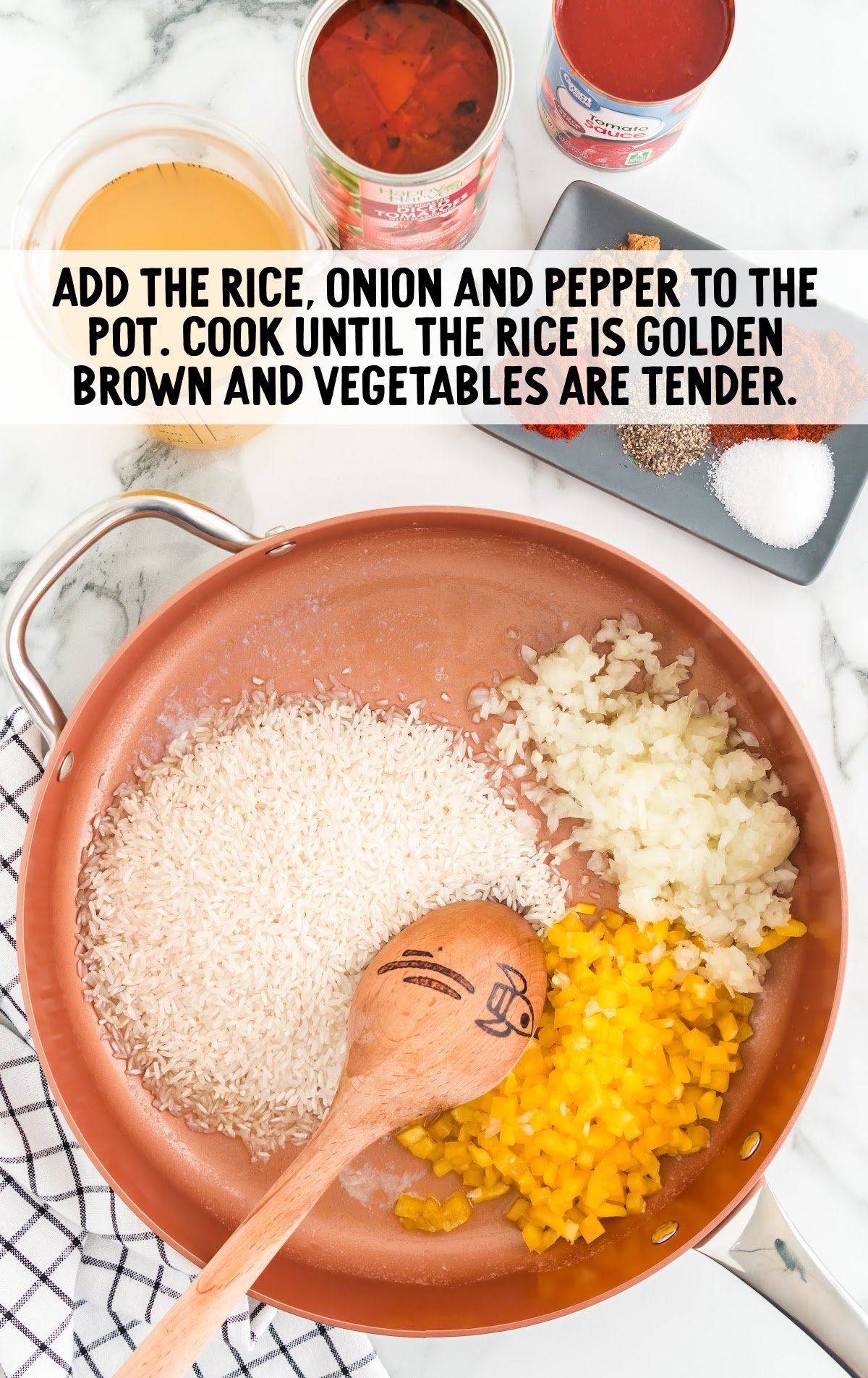 rice, onion, and pepper in a pot