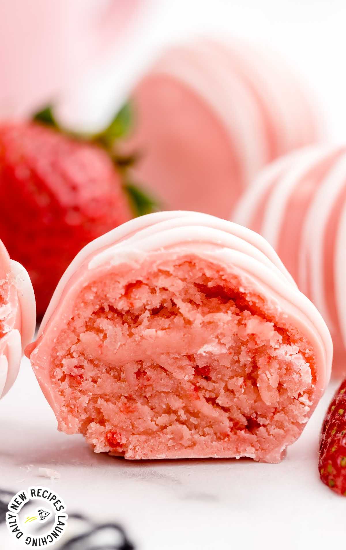close up of the inside of a strawberry cheesecake bite