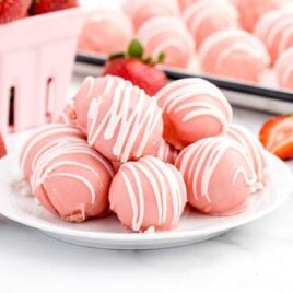 close up shot of a plate of strawberry cheesecake bites