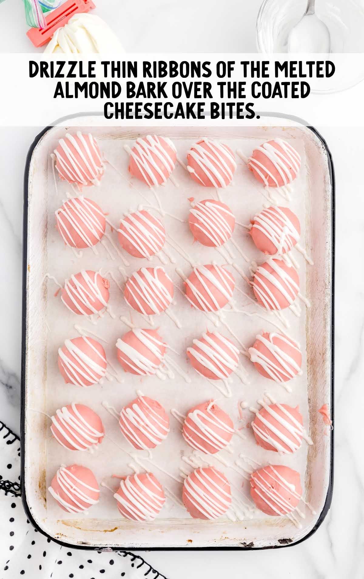 melted chocolate almond bark drizzled on top of the cheesecake bites