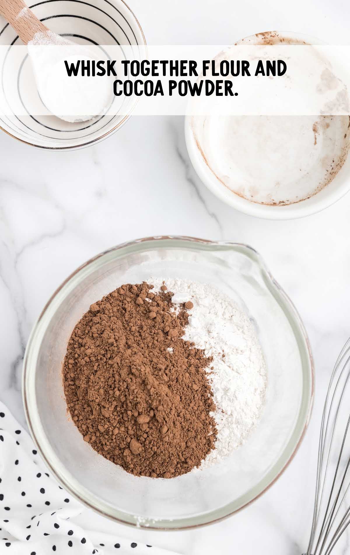 flour and cocoa powder added to a bowl