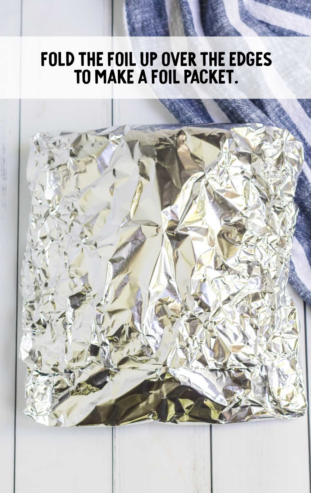 aluminum foil wrapped around the potatoes