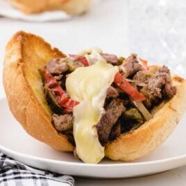 close up shot of a Philly Cheesesteak on a plate