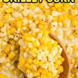 close up overhead shot of corn in a skillet and a spoonful on a large wooden spoon