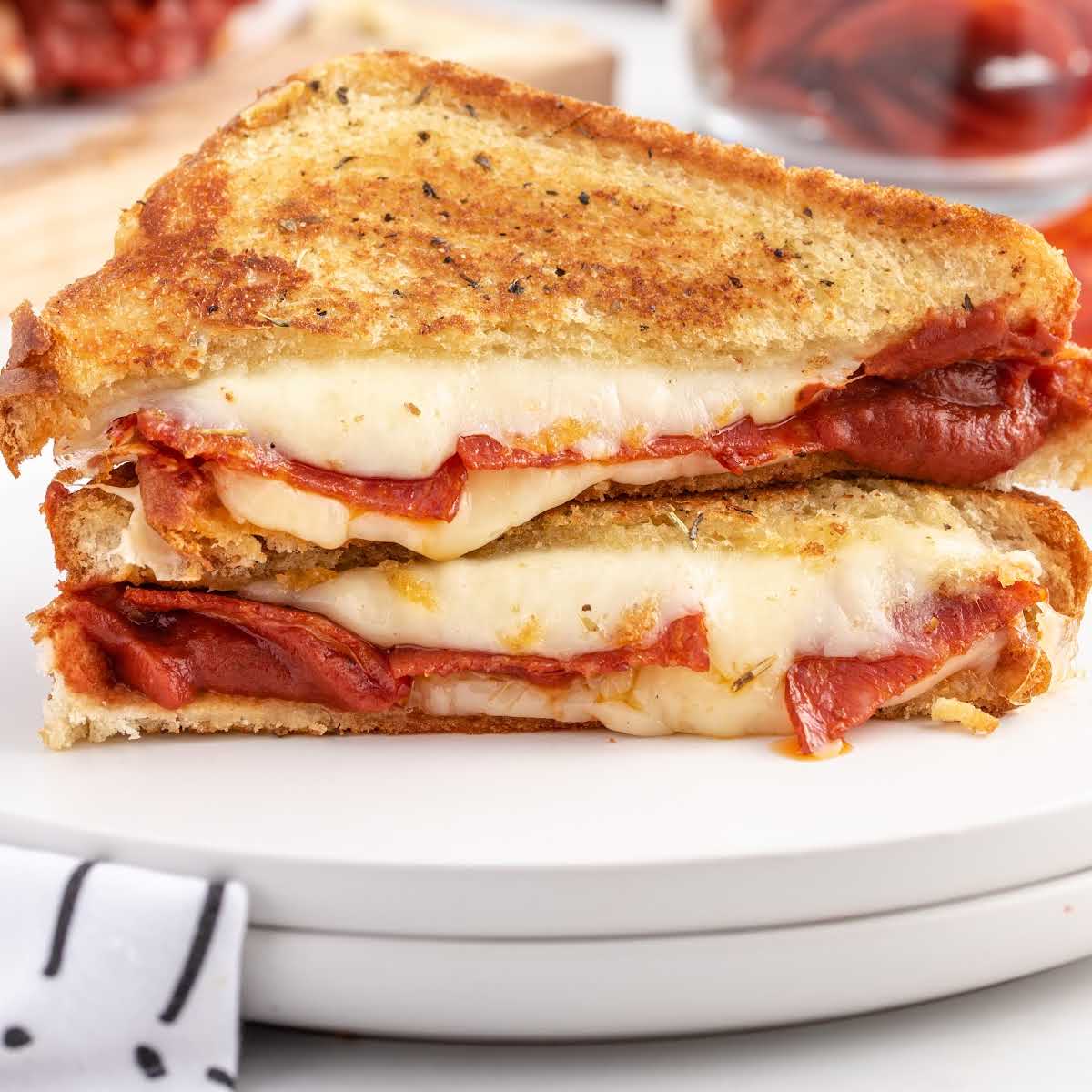 https://spaceshipsandlaserbeams.com/wp-content/uploads/2022/03/pizza-grilled-cheese-recipe-card.jpg