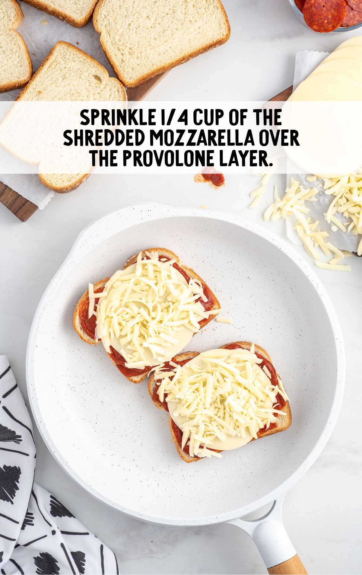 shredded mozzarella cheese placed on top of the provolone