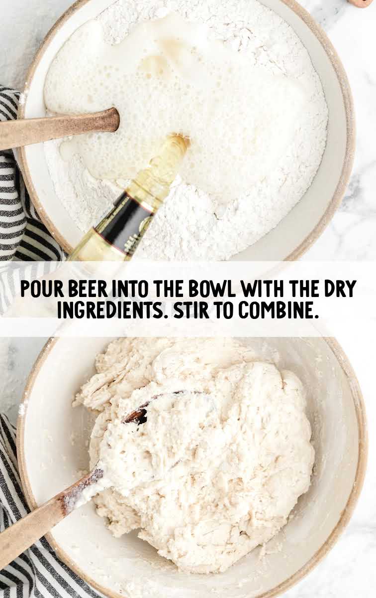 a glass of beer poured into the dry ingredients in the bowl then stirred until combined