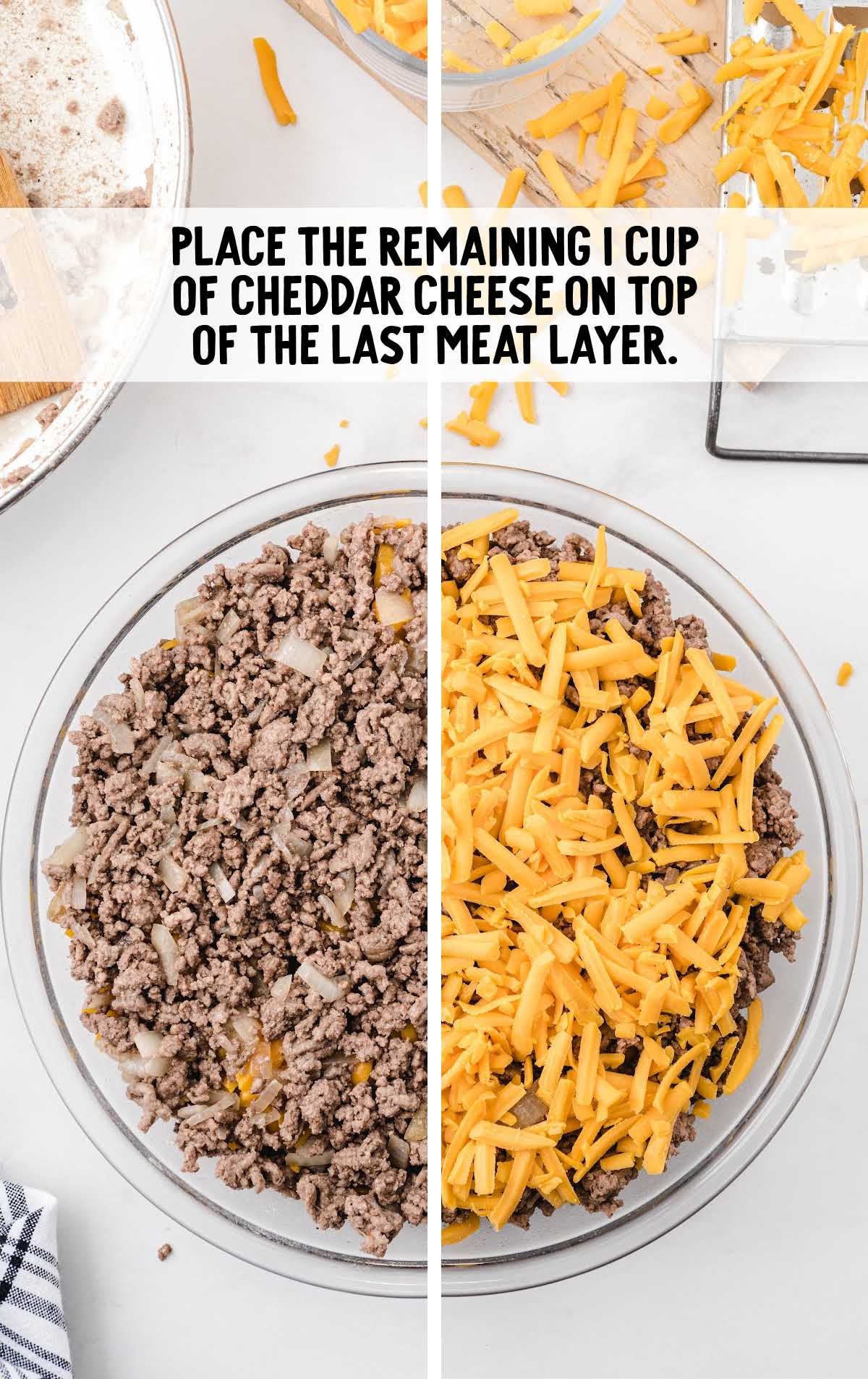 cheddar cheese placed on top of the meat layer in a baking dish