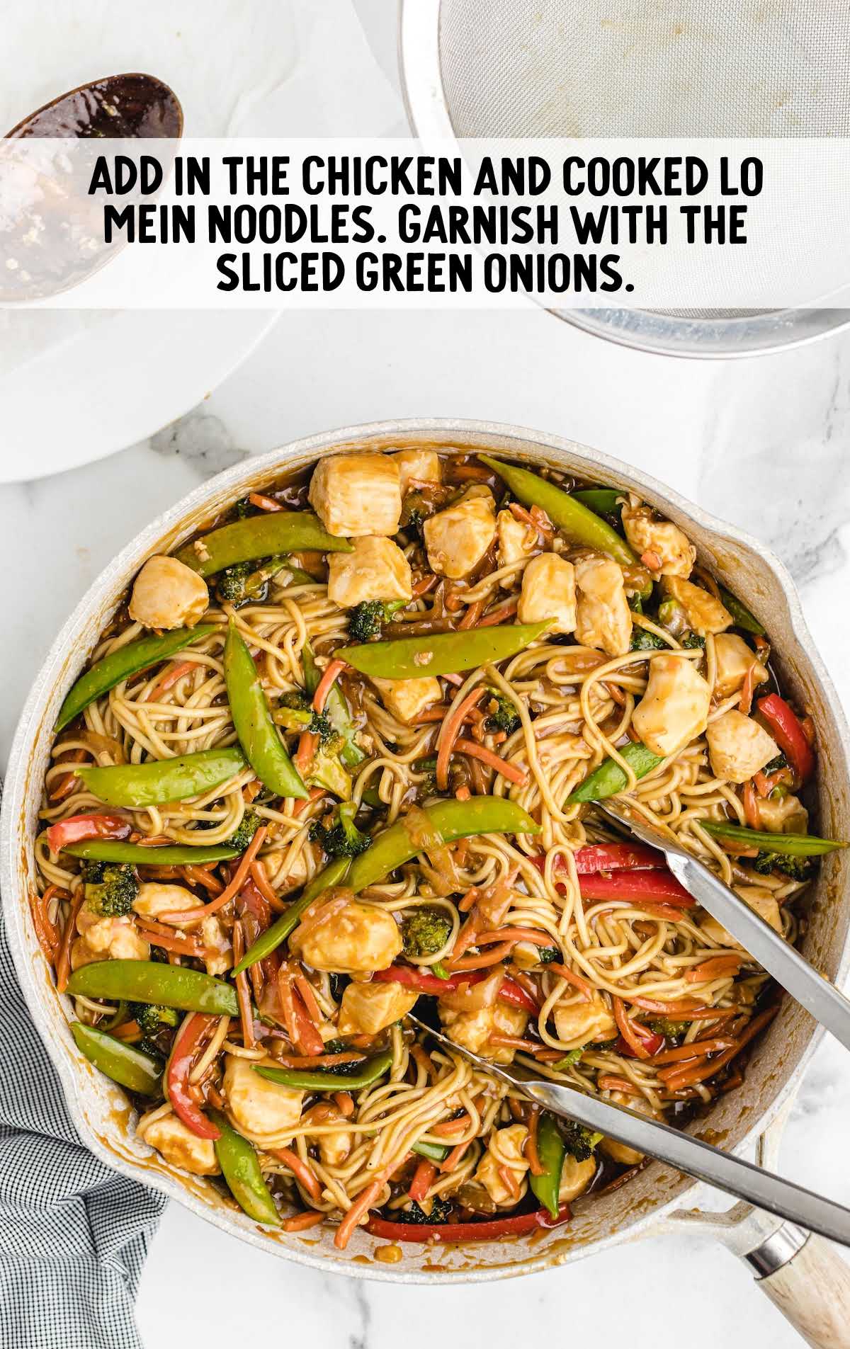 chicken and lo mein noodles added to the skillet