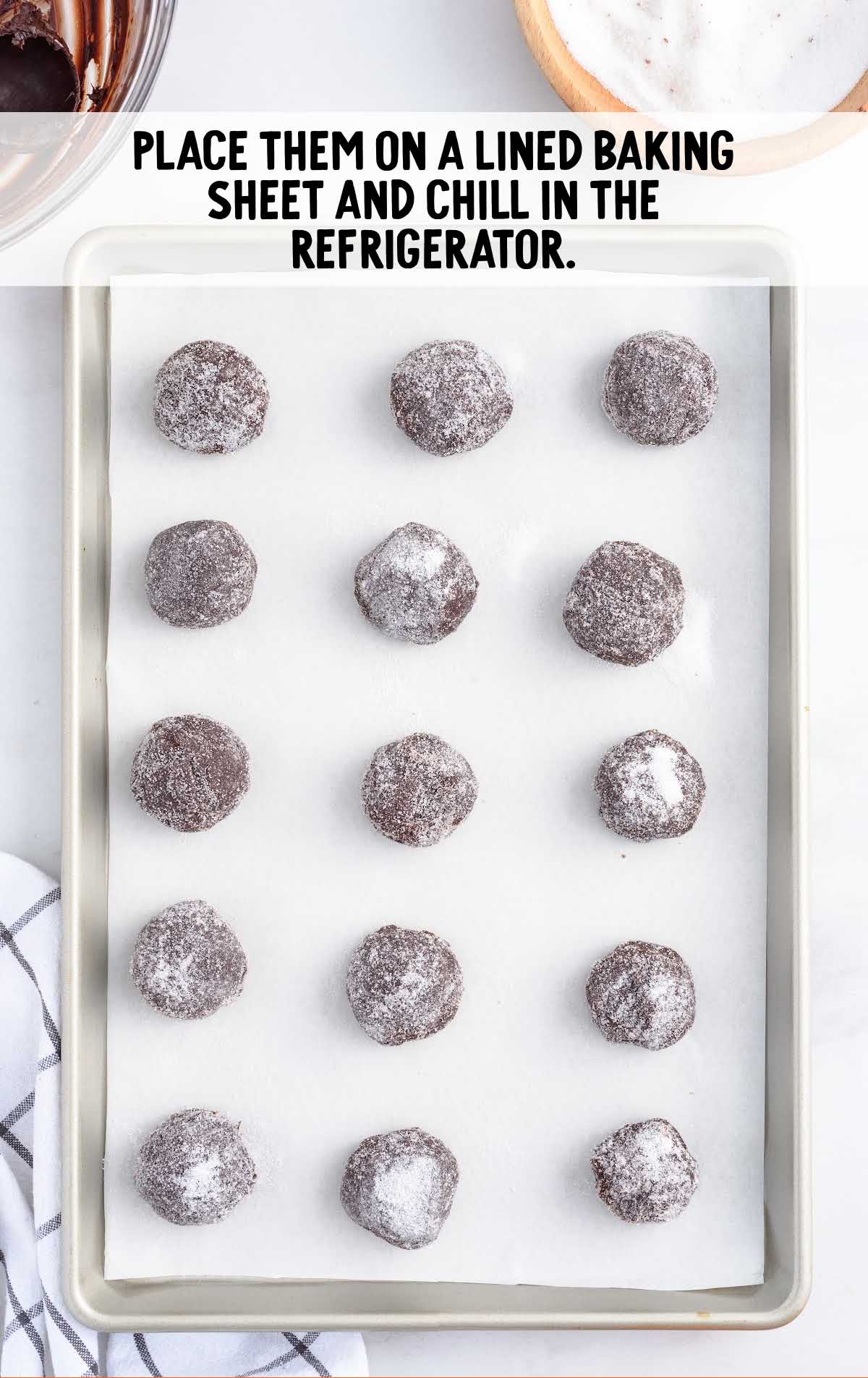 Chocolate Orange Truffles placed on a parchment lined sheet pan