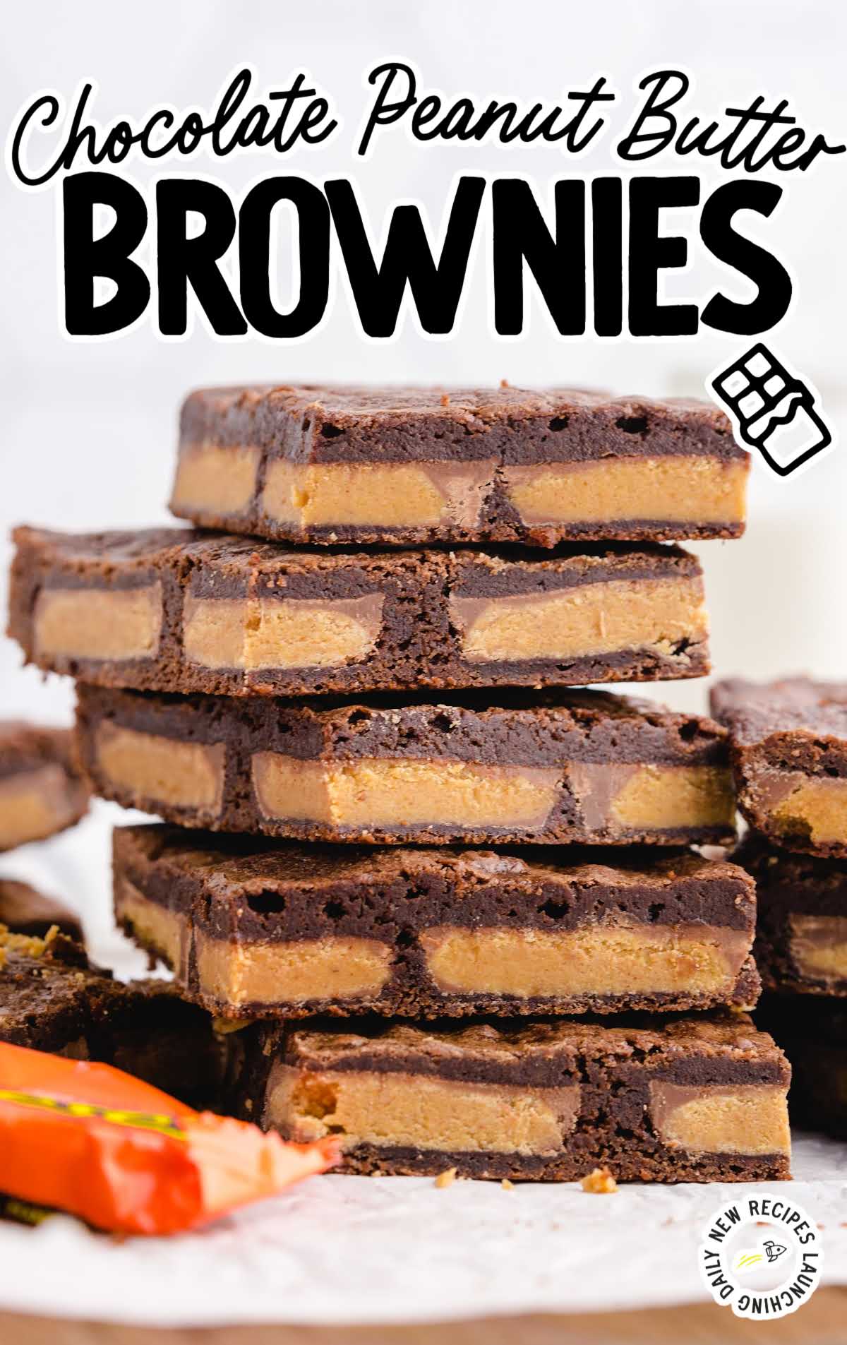 close up shot of a bunch of Chocolate Peanut Butter Brownies stacked on top of each other