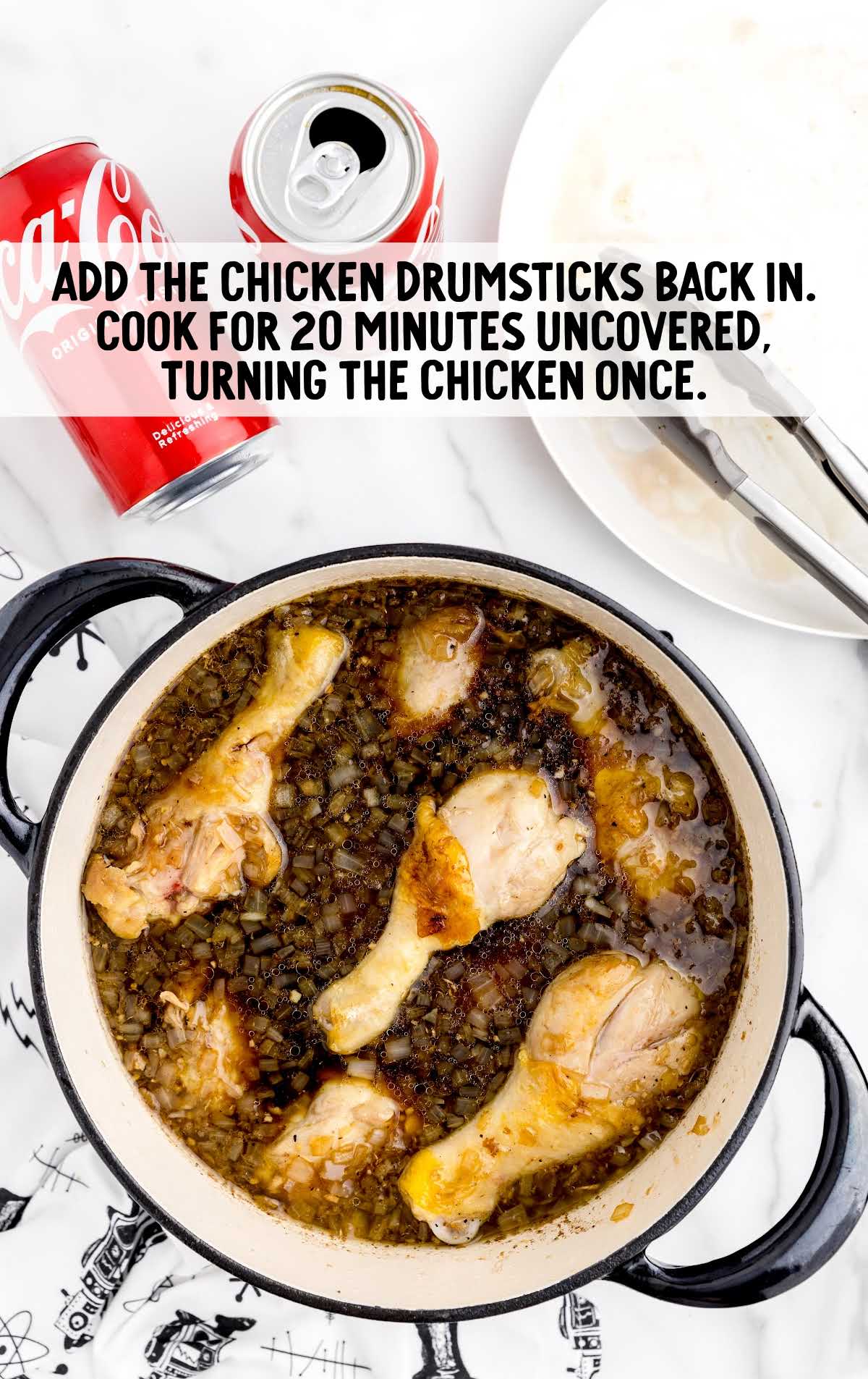 chicken drumsticks added to the coca-cola sauce in the pot