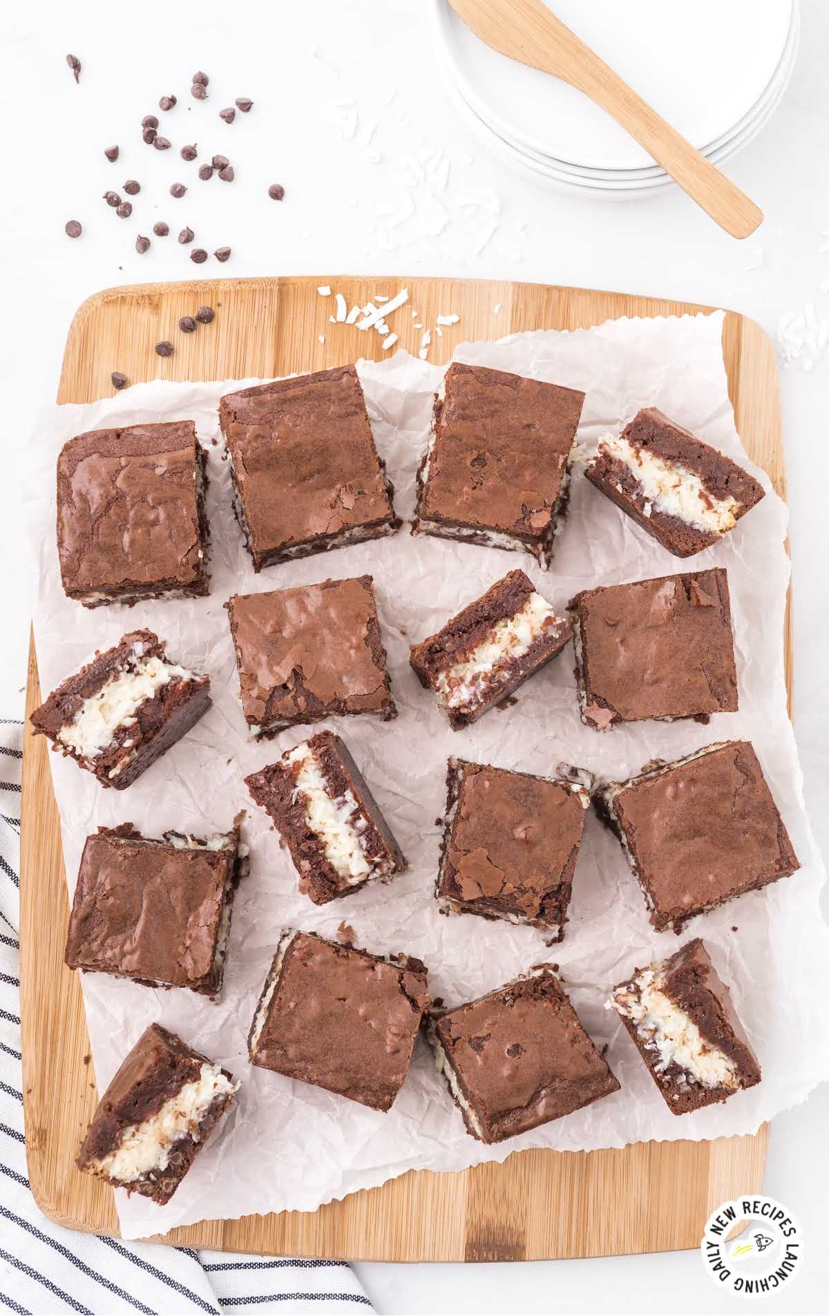 overhead shot of Coconut Brownies on a wooden board