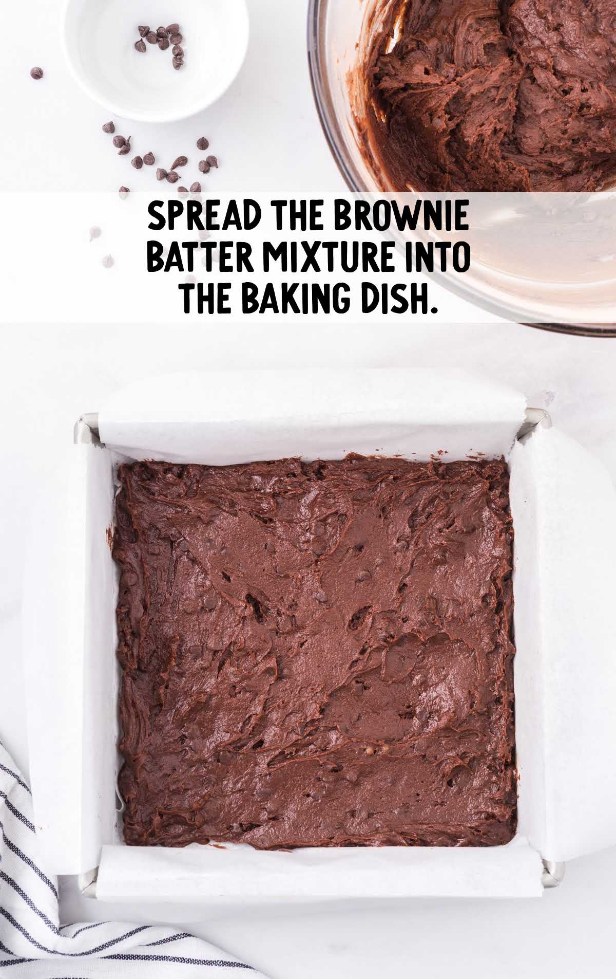 brownie batter spread into a baking dish