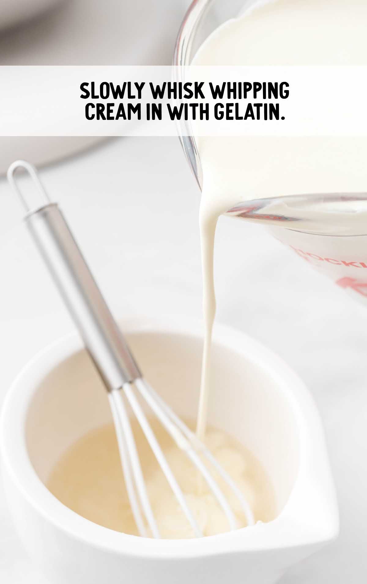 whipping cream whisked into the gelatin in a bowl