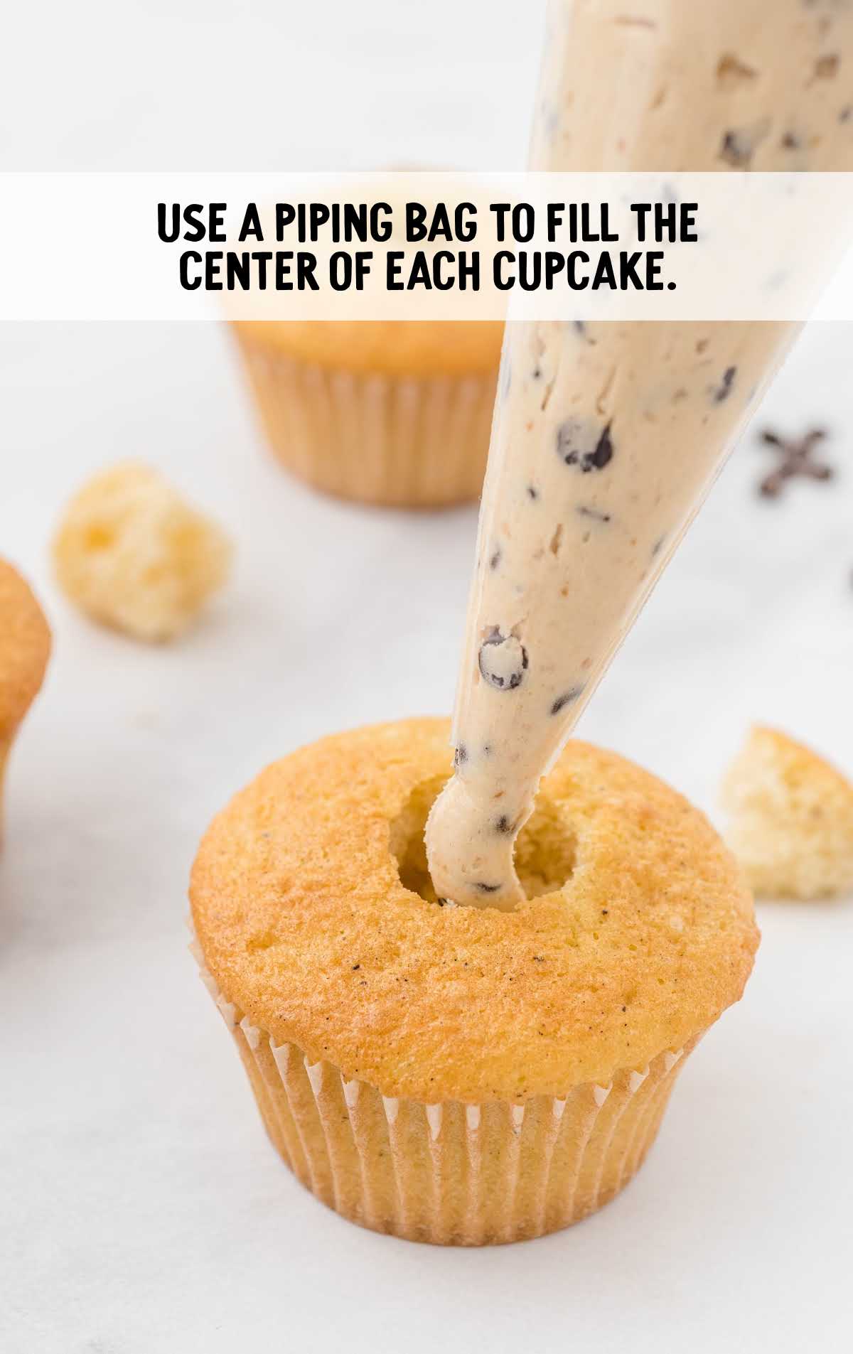cupcake filled with the cookie dough mixture
