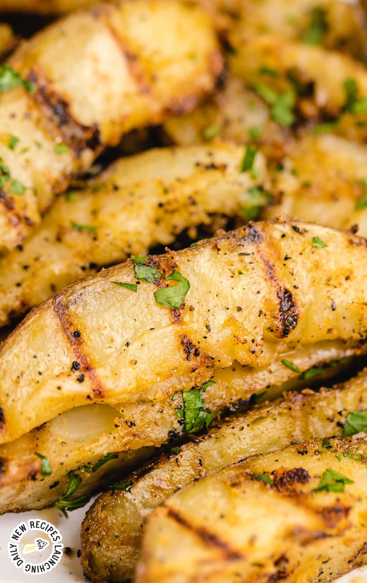close up shot of Grilled Potatoes garnished with parsley
