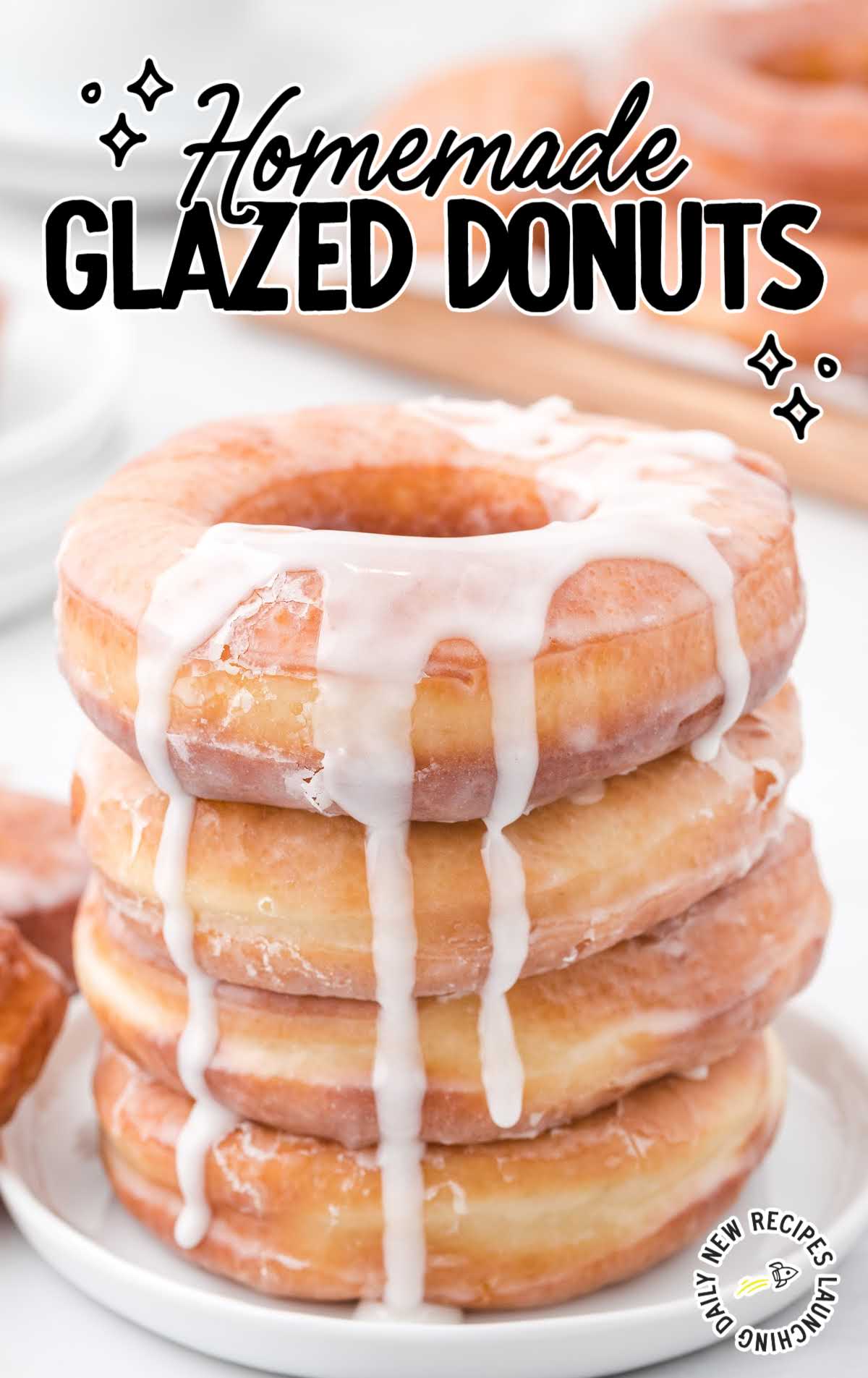 a close up shot of Homemade Glazed Donuts stacked on top of each other