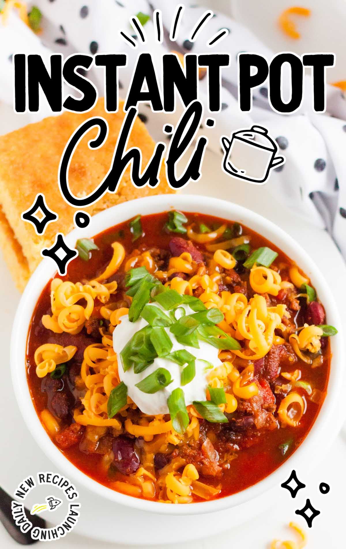 overhead shot of Instant Pot Chili topped with green onion and sour cream