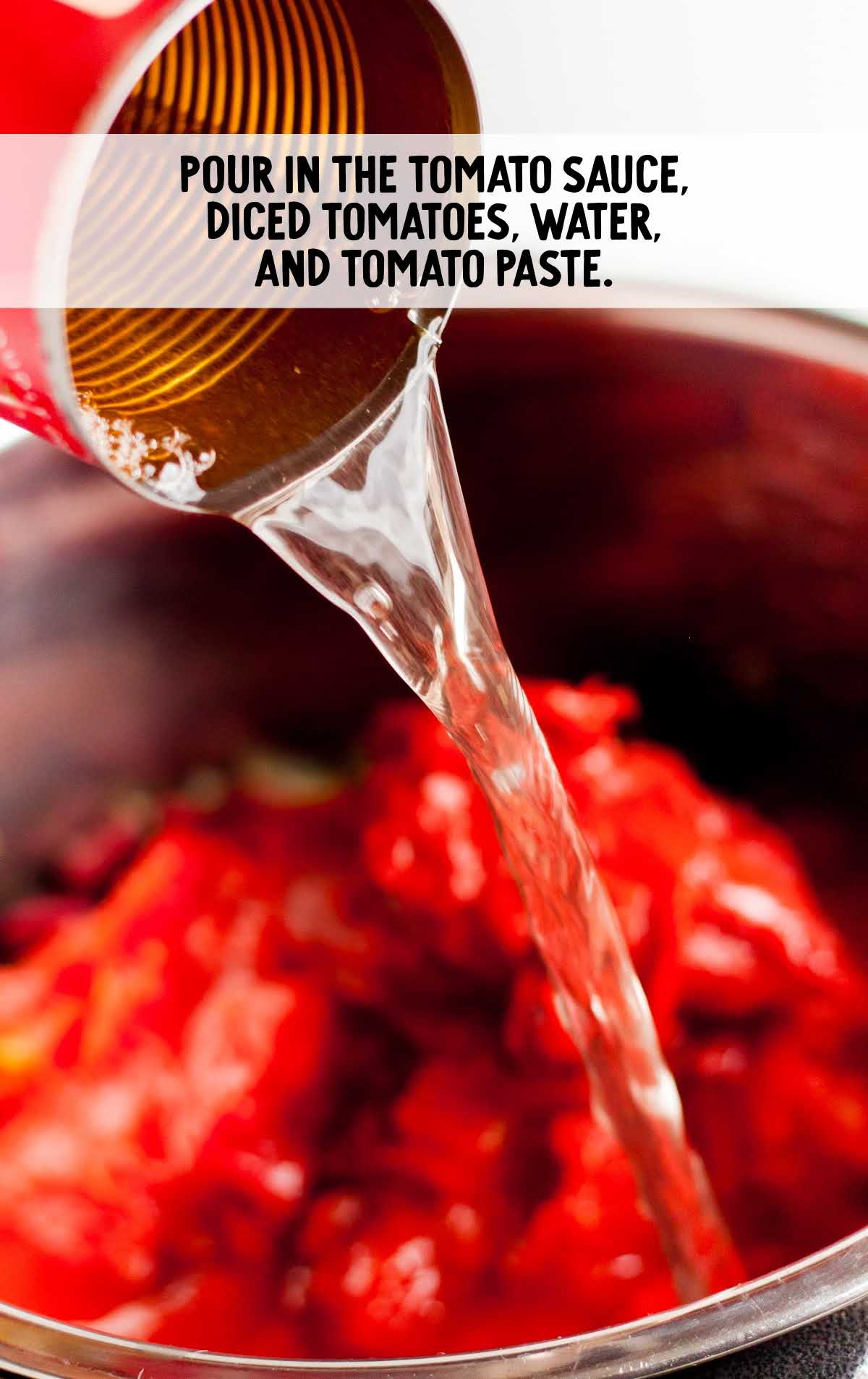 tomato sauce, diced tomato, water, and tomato paste combined in a pot