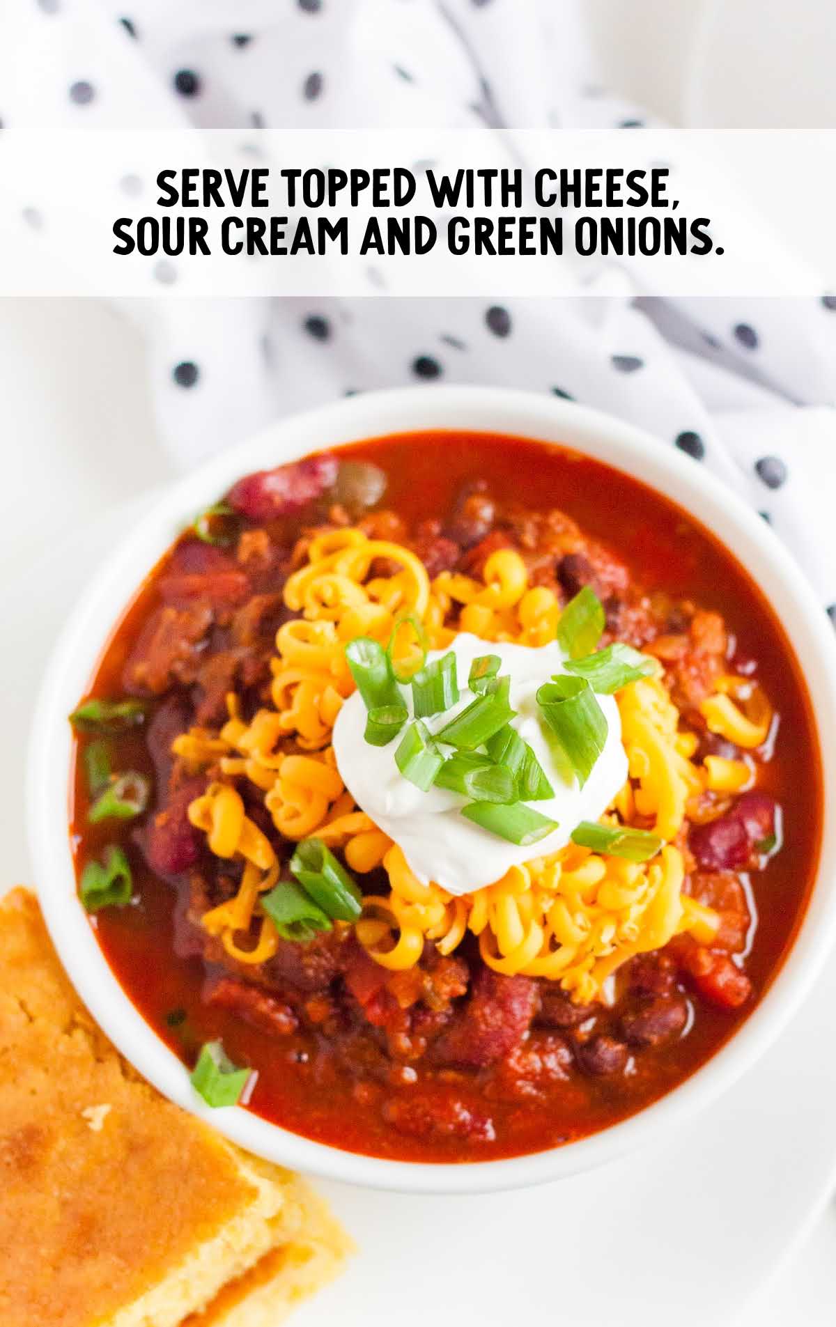 Instant Pot Chili topped with green onions and sour cream
