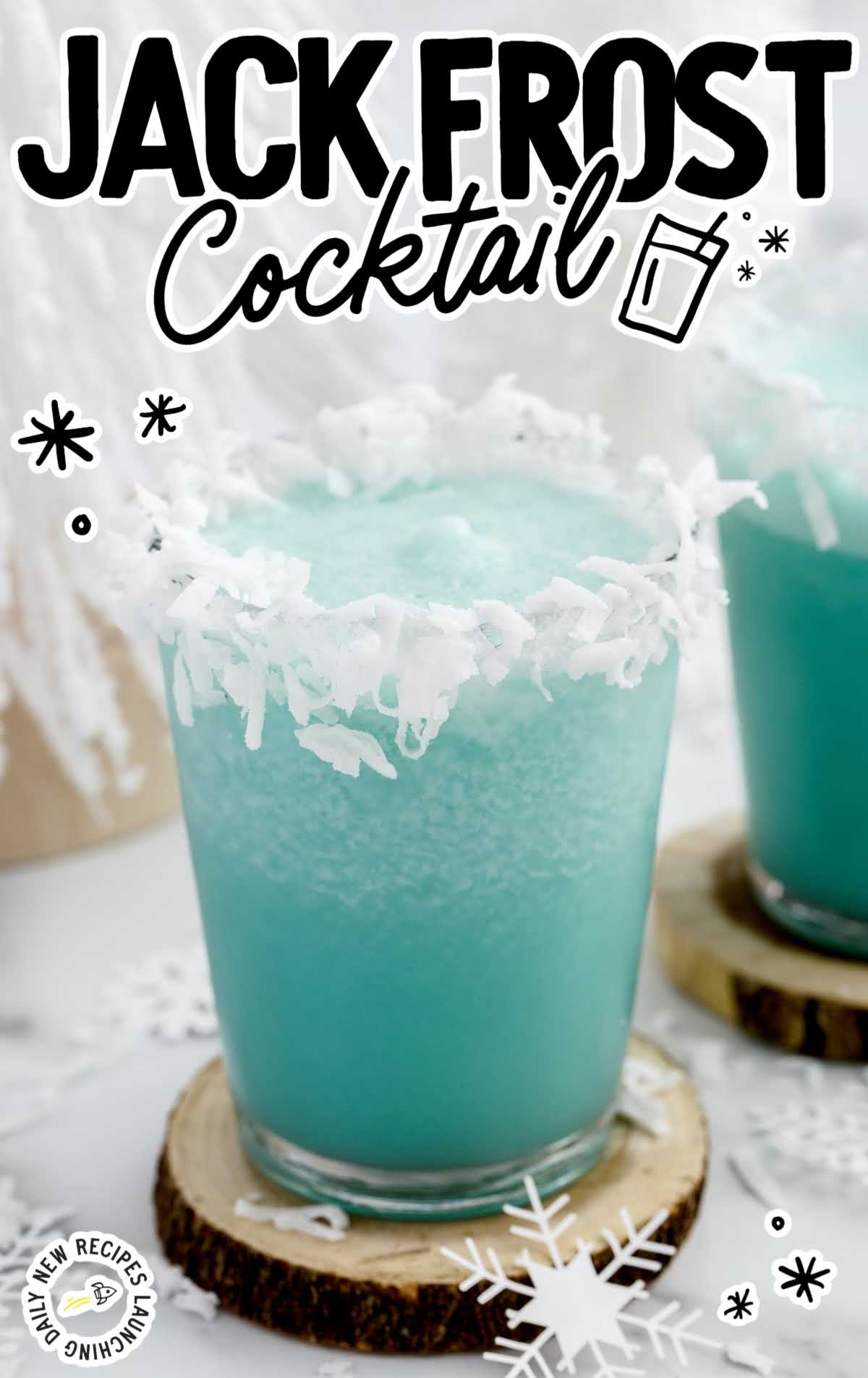 Jack Frost Cocktail topped with shredded coconut in a glass