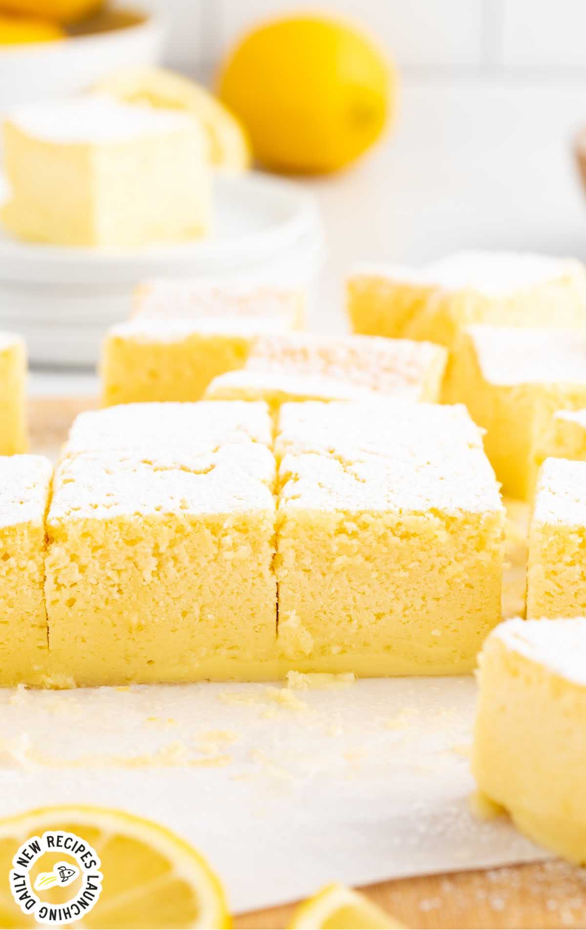 slices of Lemon Custard Cake dusted with powdered sugar