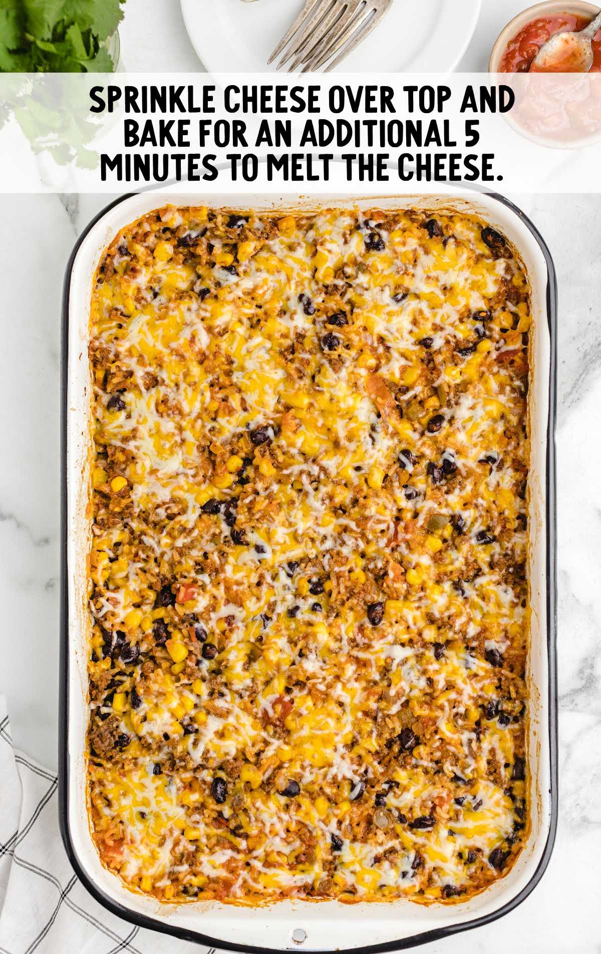 shredded cheese placed on top of the casserole then baked