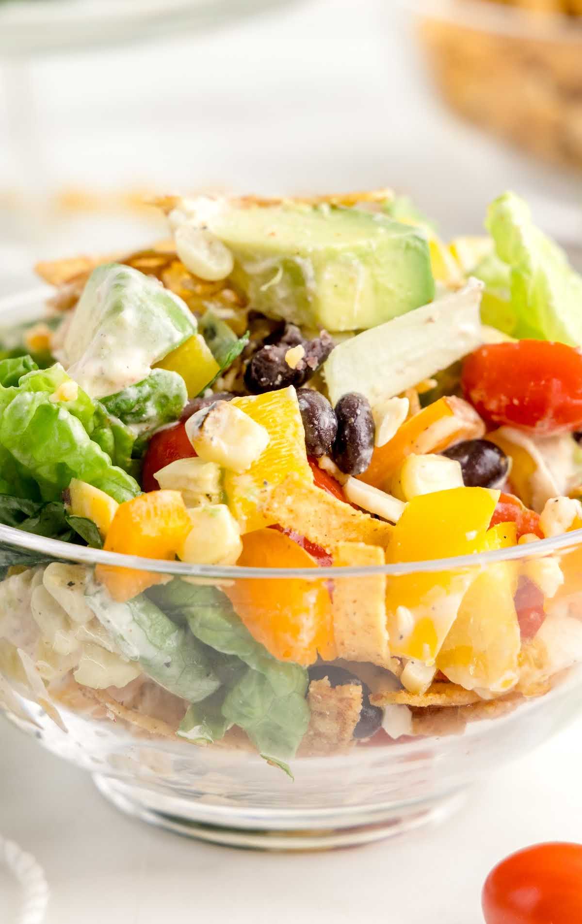 close up shot of a bowl full of Mexican Layered Salad
