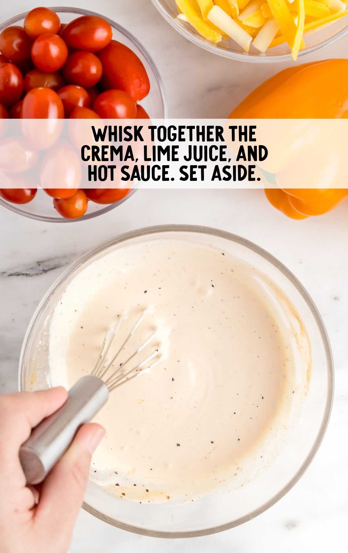 crema, lime juice and hot sauce dressing whisked together in a bowl
