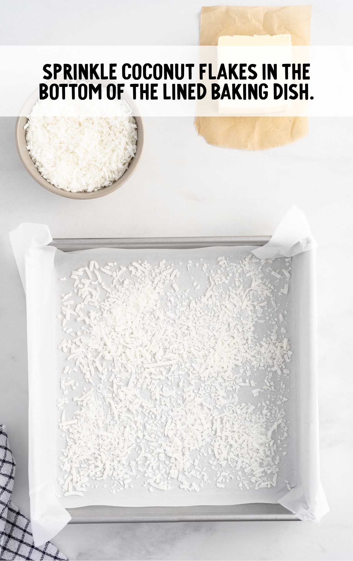 parchment line in a baking dish with coconut flakes 
