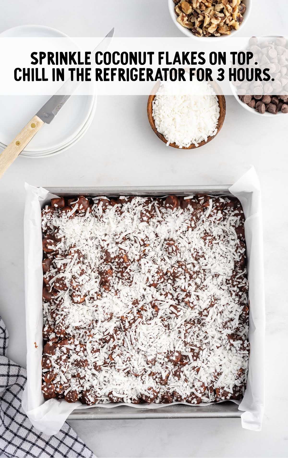 chocolate mixture in a baking dish topped with coconut flakes